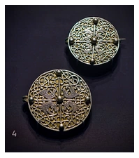 Two silver brooches with Celtic-style markings